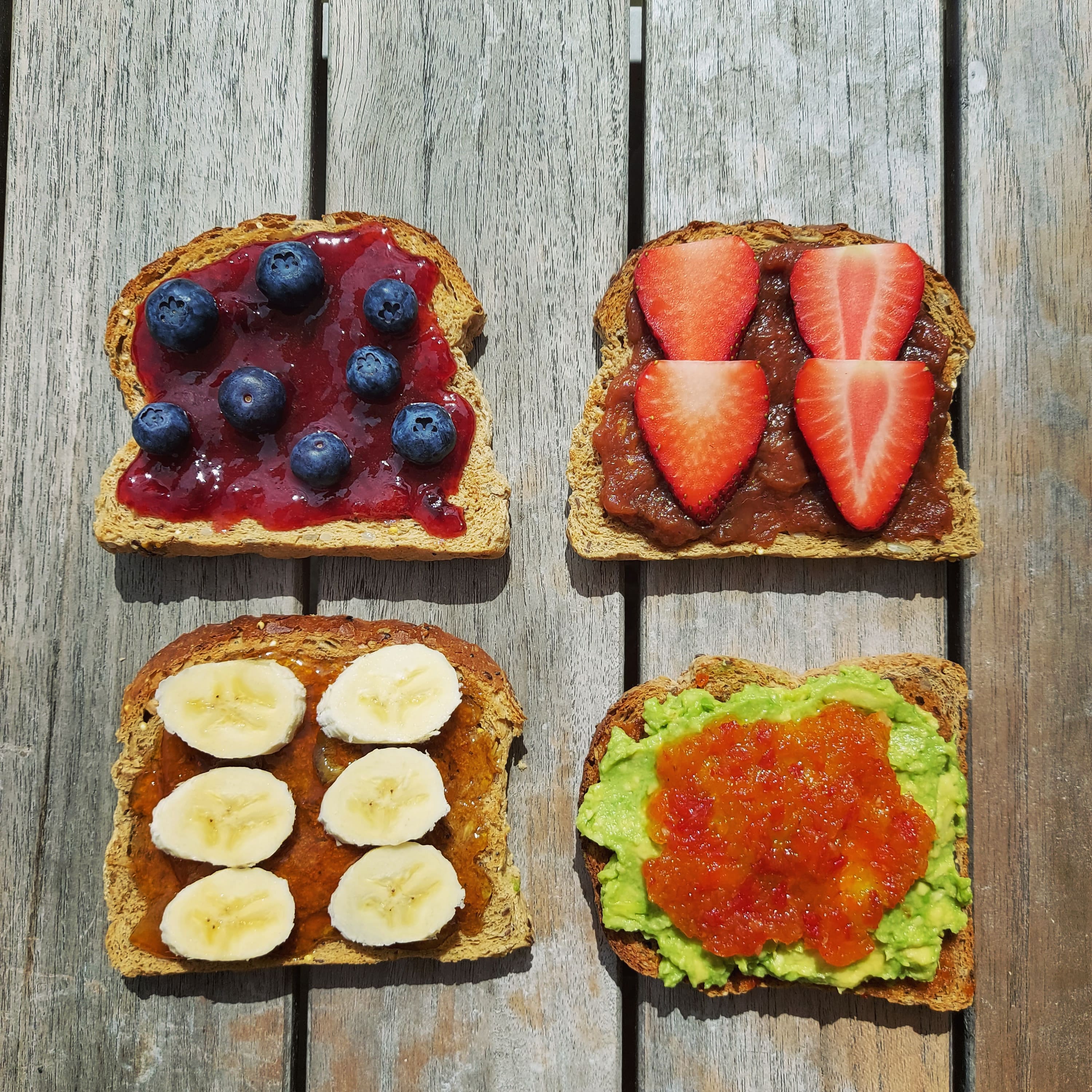 Four slices of toast with jam